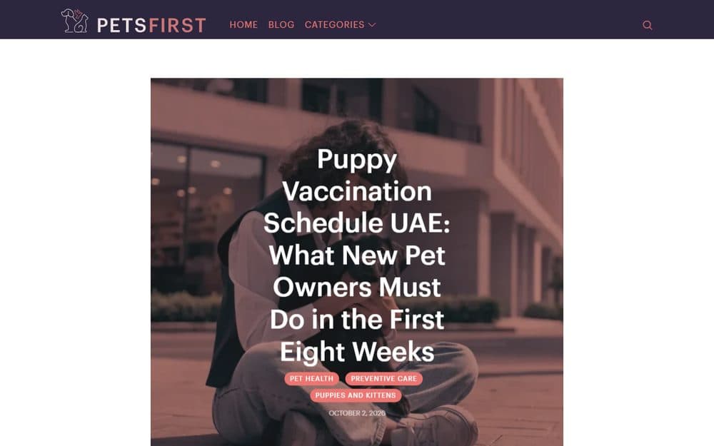 The Petsfirst blog article page: a purple header bar, then a large header photo of a young woman holding a black puppy with the title over it.